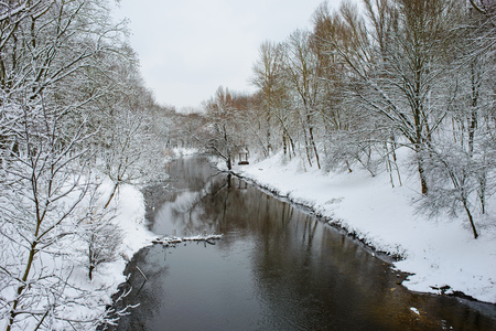 Winter landscape with the river in frosty day.の写真素材