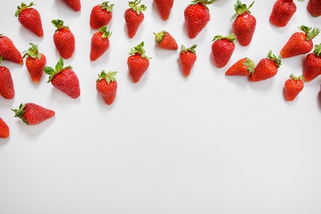 strawberry fruits on the right side on wooden background with copy space. View from above.の写真素材