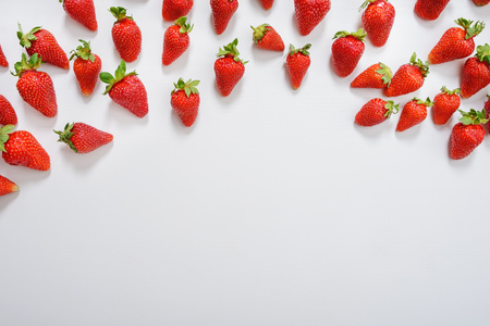 strawberry fruits on the right side on wooden background with copy space. View from above.の写真素材