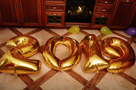 New 2019 Year is coming. Group of cheerful young people carrying gold colored numbers and have fun at the party.の写真素材