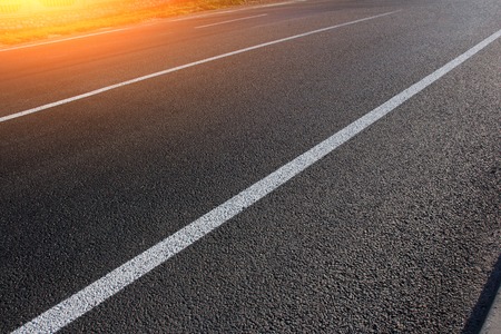 Asphalt road with marking lines white stripes.の写真素材