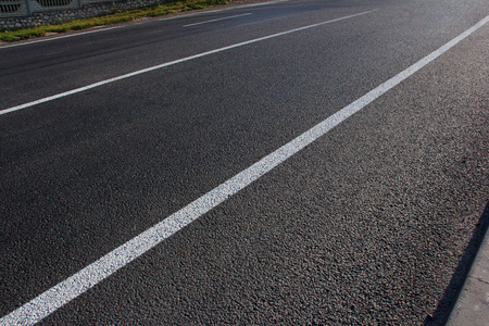 Asphalt road with marking lines white stripes.の写真素材