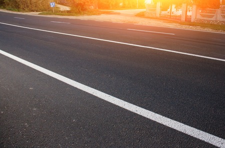 Asphalt road with marking lines white stripes.の写真素材
