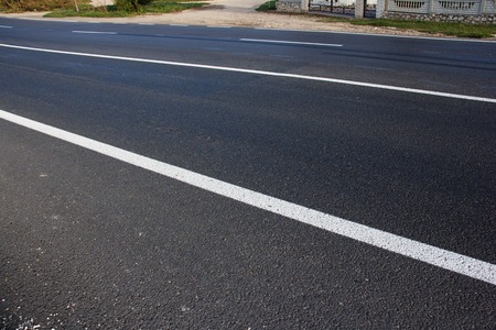 Asphalt road with marking lines white stripes.の写真素材