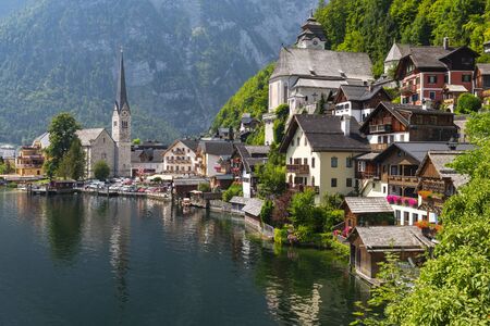 View of famous Hallstatt lakeside village with Hallstatter Lake in the Alps, Salzkammergut Austria.の写真素材