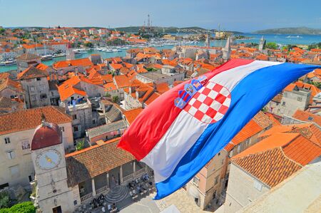 Flag and view on Trogir from Cathedral of Saint Lawrence, Croatia.の写真素材