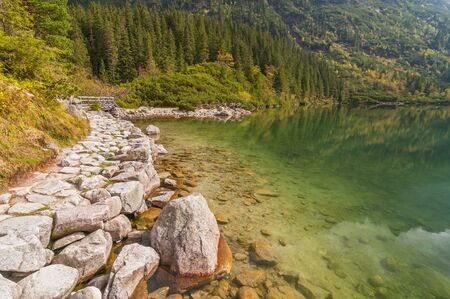 Colorful water of Morskie Oko lake, Tatra mountains, Poland.の写真素材