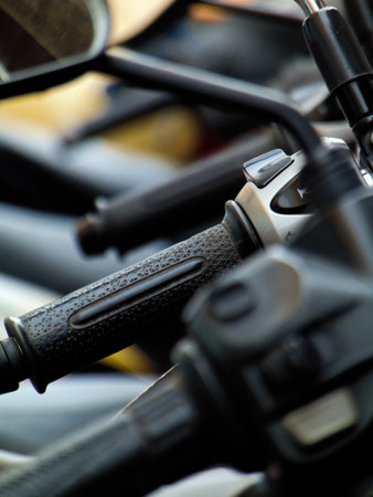 Close up of motorcycle handlebar. Selective focus with shallow depth of field.の写真素材