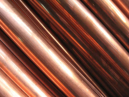Close-up of copper pipes, abstract backgroundの写真素材