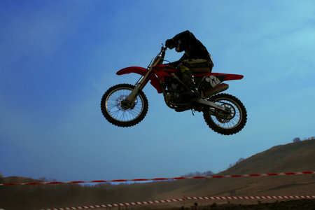 Sportsman flying on his offroad motorbyke