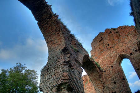 Old architectural arch in a ruin with deep sky in background - HDR imageの写真素材