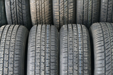 Stack of new tires in a shop ready to sellの写真素材