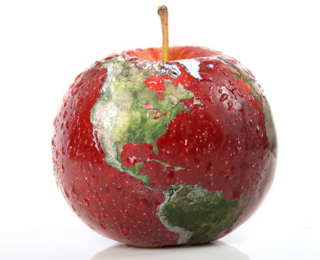 Red Apple with earth on it isolated over whiteの写真素材