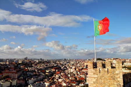 Landscape of Lisbon with national flag in foregroundの写真素材
