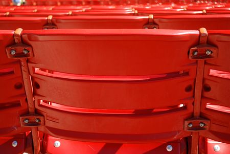 several numbered red seats in an auditoriumの写真素材