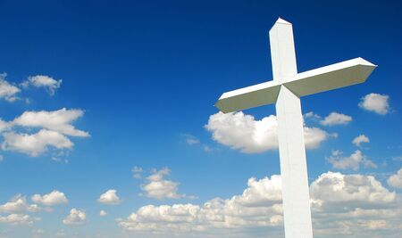Giant white cross in a sunny dayの写真素材