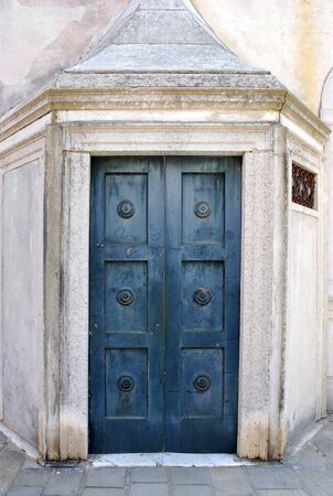 Old colored wood door closeup and handleの写真素材