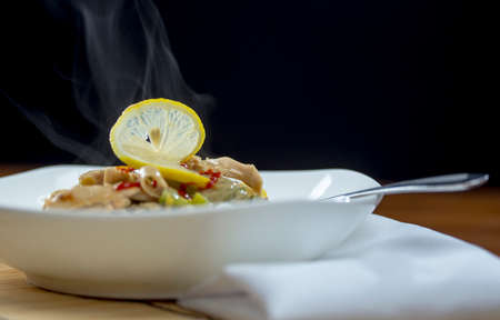 Closeup view of a bowl of thai green curry and rice vermicelli noodles ethnic cuisineの写真素材