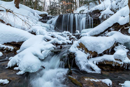 flowing waterfalls in winter, owen sound ontario, weaver's creekの写真素材
