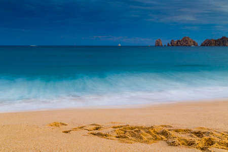 View of Waves at Sandy Beach of Cabo San Lucas in Mexicoの写真素材