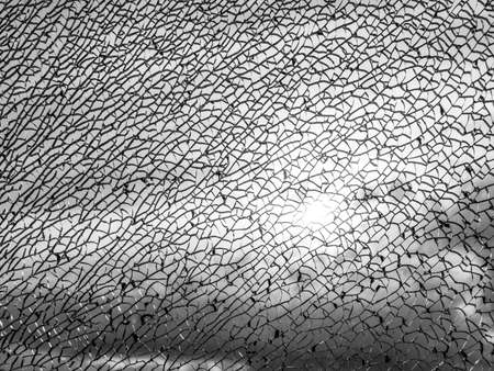 broken glass texture against sunlightの写真素材
