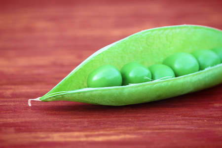 Open green pod of peaの写真素材