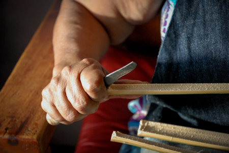 Craftsman hands working with vegetable fiberの写真素材