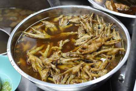 Chicken feet in a bowl with spicy soup, street food in asia thaiの写真素材