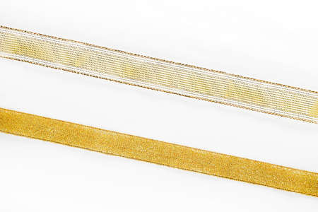 golden ribbon on white backgroundの写真素材