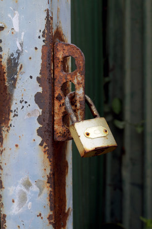 old key lock on the metal fenceの写真素材