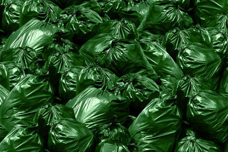 Background garbage dump Green garbage bags, Bin,Trash, Garbage, Rubbish, Plastic Bags pileの写真素材