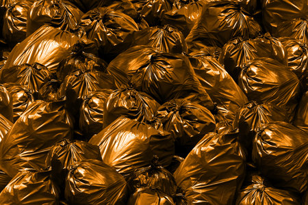 Background pile of garbage bags orange, Bin,Trash, Garbage, Rubbish, Plastic Bags pileの写真素材