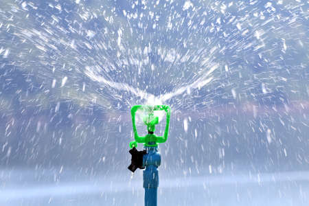 sprinkler water automatic in garden for watering grassの写真素材