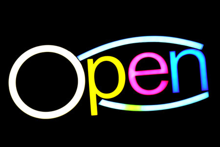blurred text OPEN sign LED Bokeh light colorful on dark wall, Neon Light led letter Open on background blackの写真素材