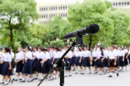 Microphone close up shot on Blurred Students high school walking for Backgroundの写真素材