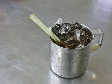 Glass, stainless steel ice water drinkの写真素材