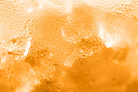 water drop soda ice baking background fresh cool ice orange texture, selective focusの写真素材