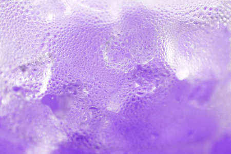 water drop soda ice baking background fresh cool ice purple texture, selective focusの写真素材
