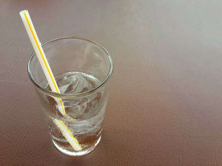 Glass of ice on table, Water clear glass and coldの写真素材