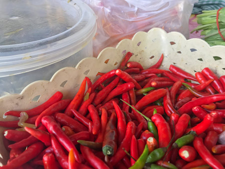 Chili grained red organic basket, Pile of red chili smaller lots and garlic grained