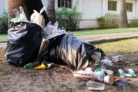 Pile of Garbage plastic black and trash bag waste many on the footpath, pollution trash, Plastic...