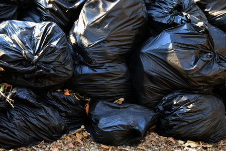 pile waste plastic bags many garbage trash closeup for background, pile of garbage plastic black,...