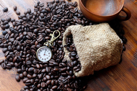 Coffee, Coffee beans black, Brown black coffee beans and watches on the wood textureの写真素材