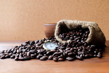 Coffee, Coffee beans black, Brown black coffee beans and watches on the wood textureの写真素材