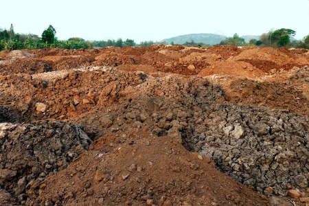 soil pile many on ground, soil for agriculture farming, field soil for construction home, soil backgroundの写真素材
