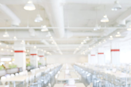 blur image canteen dining hall room white, eating food in university canteen blur background, blurred background cafeteria white in interiorの写真素材