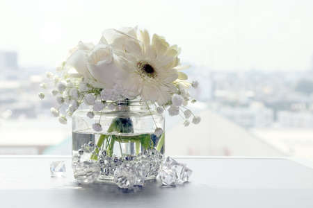 white flower beautiful in a clear glass vase, flower in vase for interior decoration office and homeの写真素材