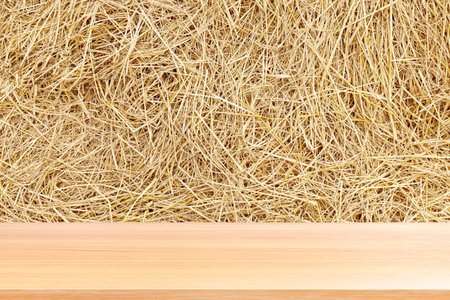 wood plank on straw, empty wood table floors on straw hay dry background, wood table board empty...