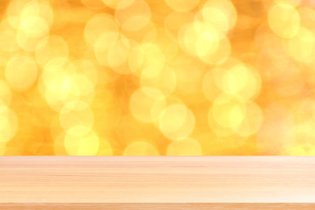 wood plank on bokeh golden yellow colorful background, empty wood table floors on bokeh glitter...