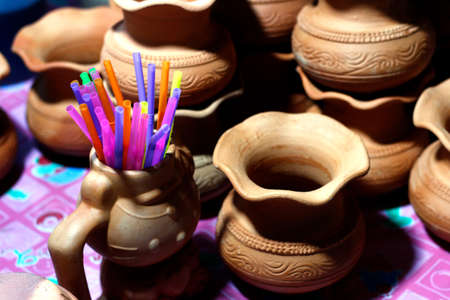 straws plastic in pottery pot for sweet juice at night market street foods thailand (selective focus), straws colors, straws many colorfulの写真素材